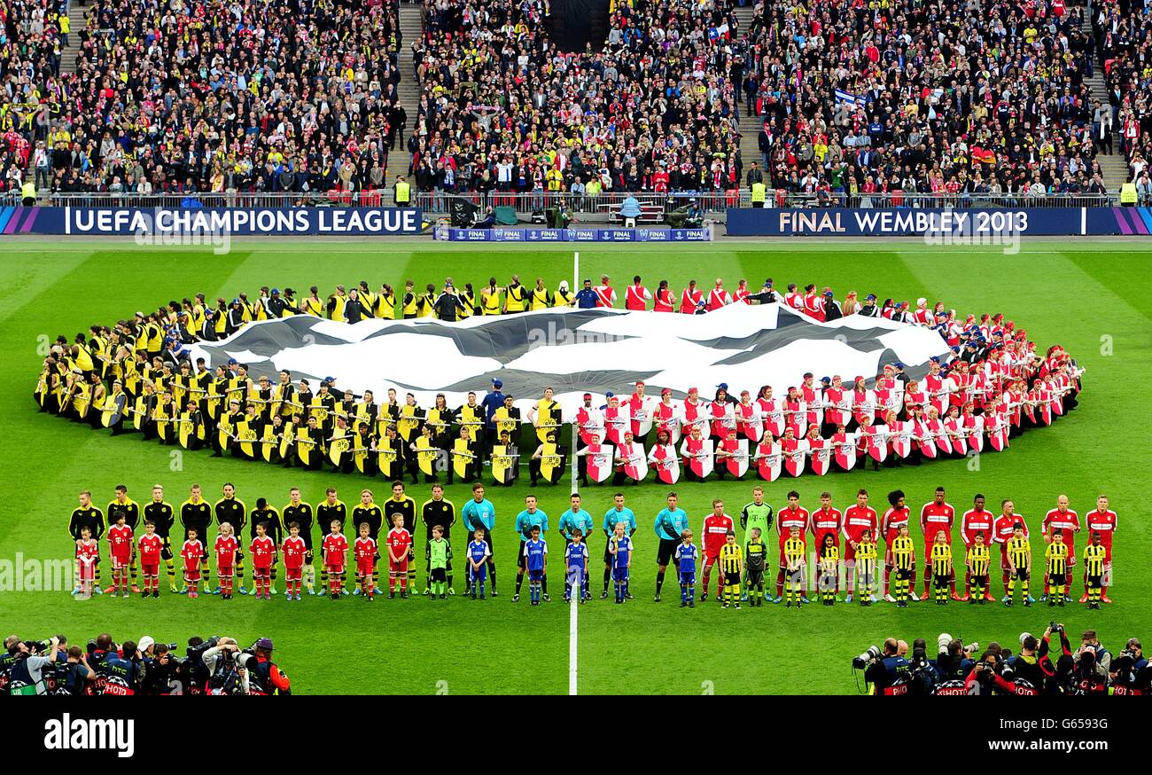 borussia-dortmund-and-bayern-munich-players-line-up-prior-to-kick-G6593G